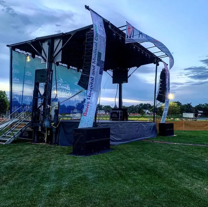 Outdoor stage and line array sound system by SwissMixx Audio for a city event in Davis County Utah