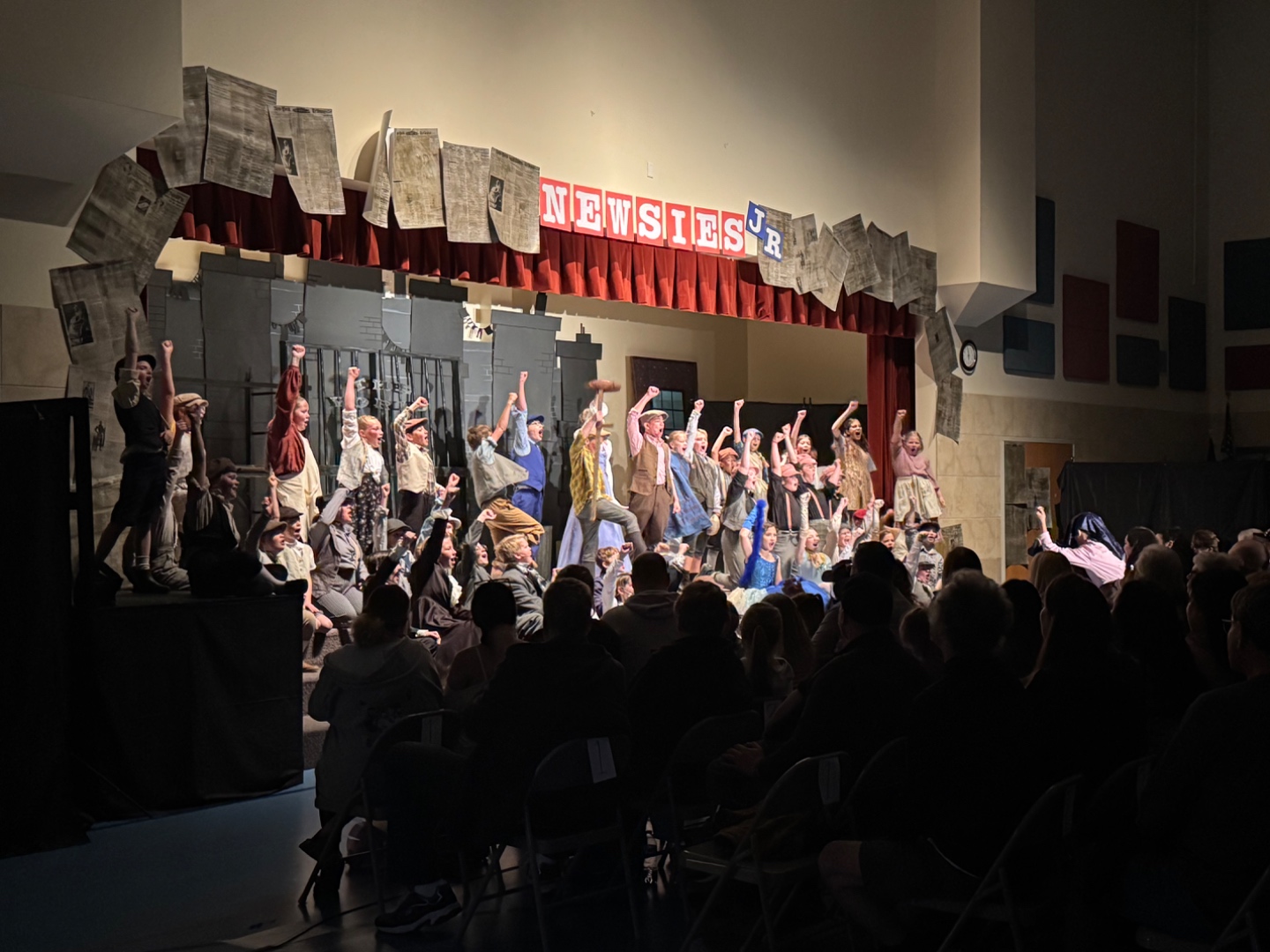 Newsies Jr school musical full cast on stage with fists raised, SwissMixx Audio school theatre sound Meridian Idaho