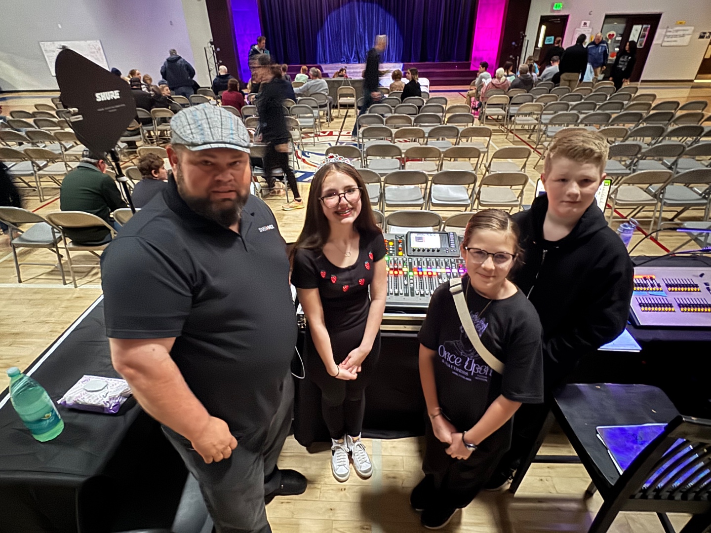 Mark and middle school students at mixing console during school production, Idaho school theatre audio training