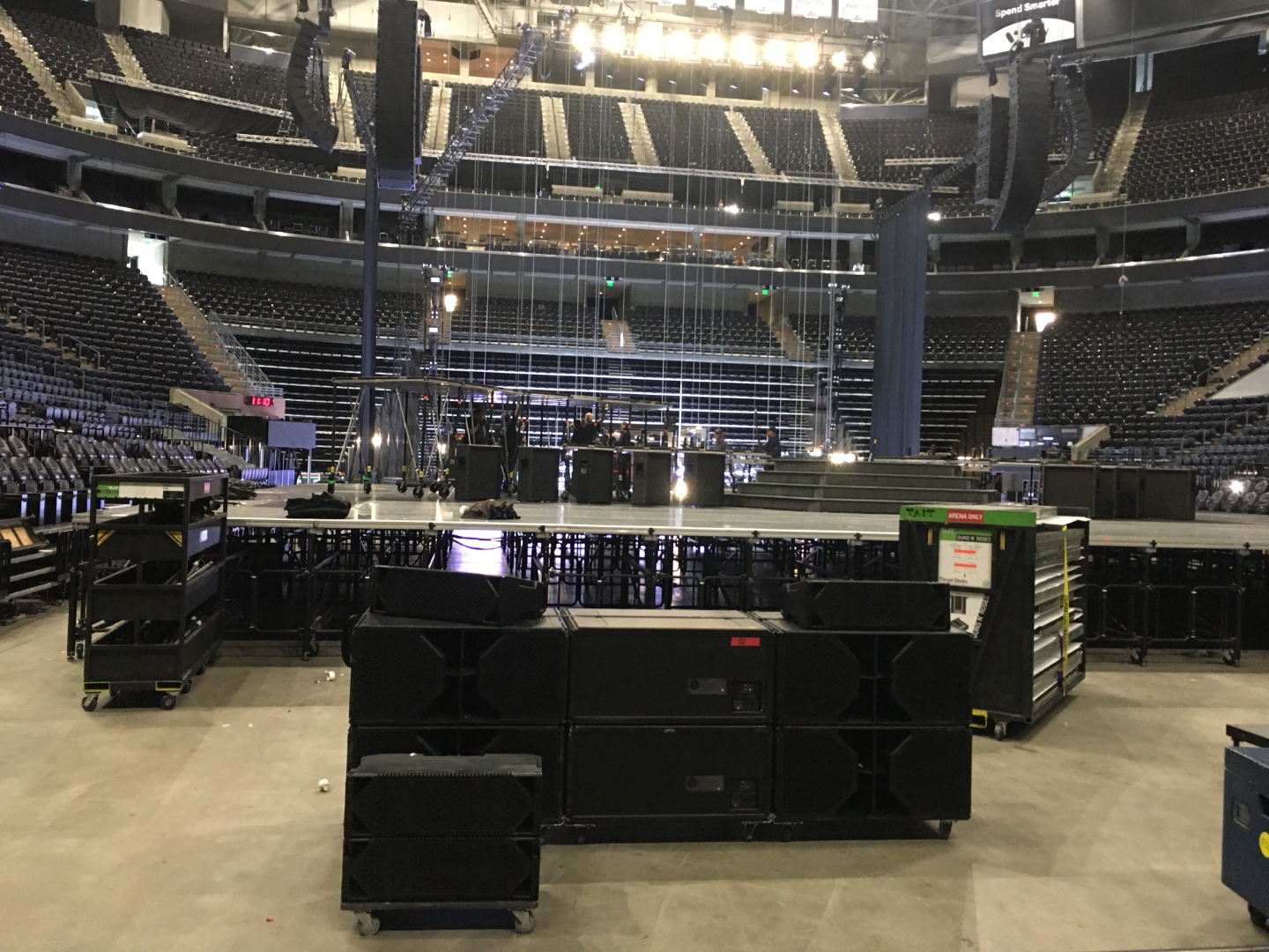 Arena floor during Guns N Roses production load-in with full stage rigging and audio system, SwissMixx Audio