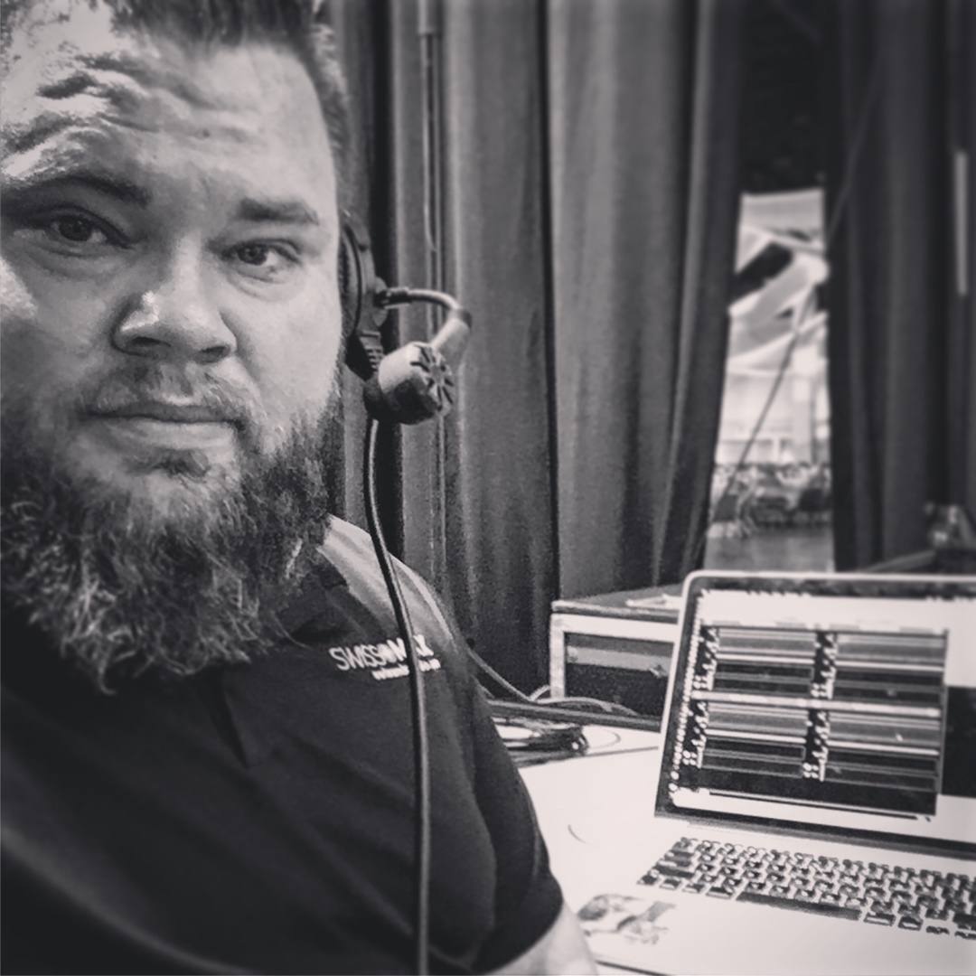 Mark Christiansen in headset comms at the production station during a live show, SwissMixx Audio live event production Treasure Valley Idaho