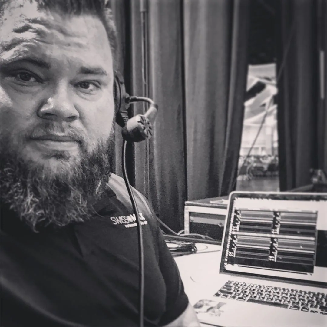 Mark Christiansen in headset comms at the production station during a live show, SwissMixx Audio live event production Treasure Valley Idaho