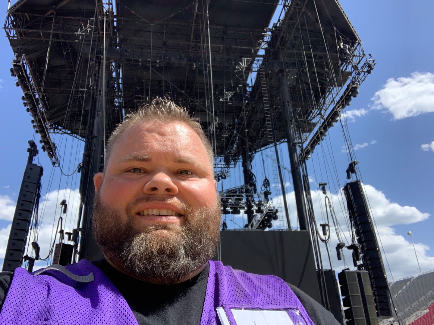 Mark Christiansen selfie in front of the Garth Brooks main stage rig with line array speaker systems at Rice-Eccles Stadium
