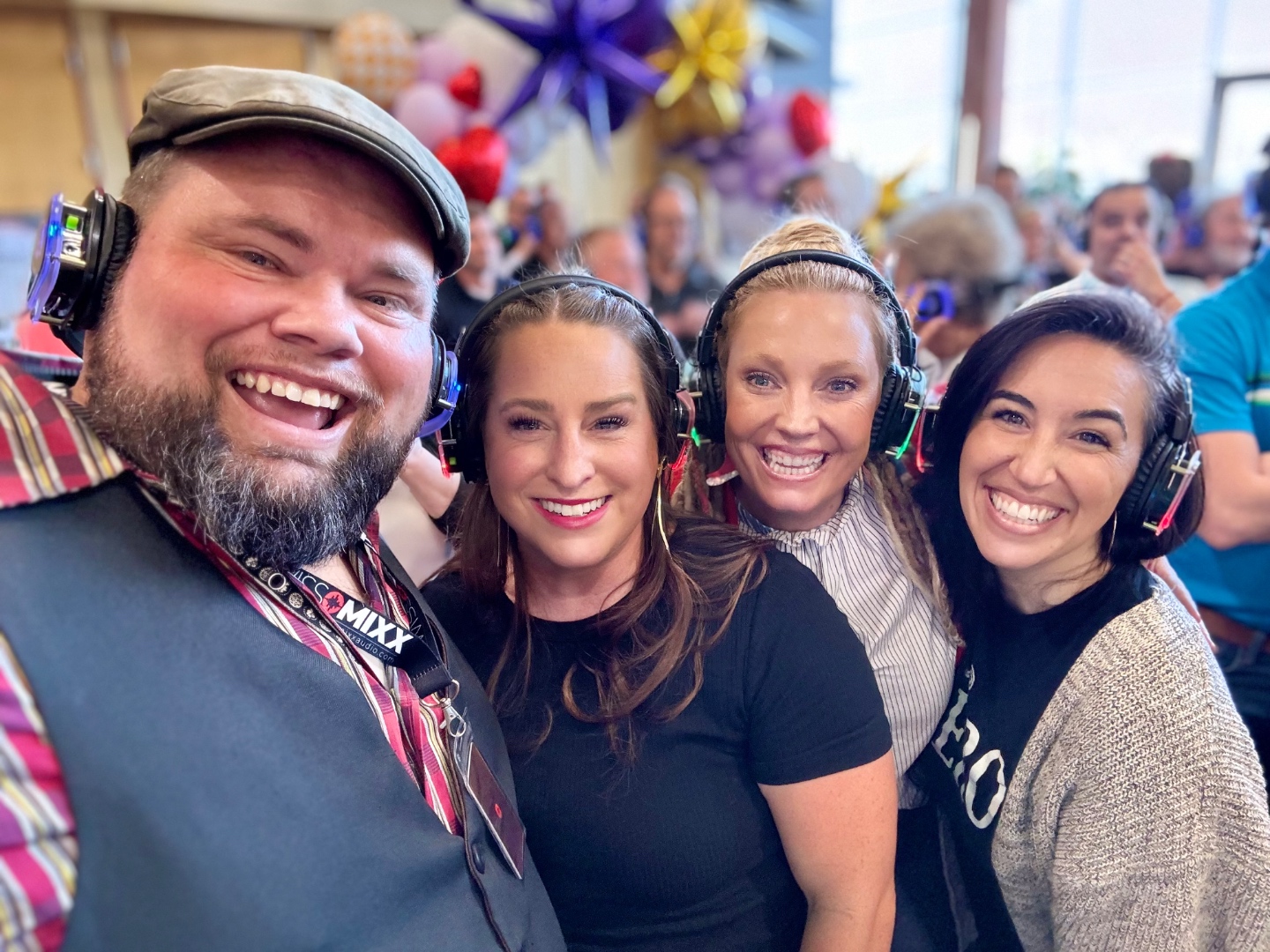SwissMixx Audio owner Mark with happy guests wearing silent disco headsets at Boise Idaho event, professional rental service