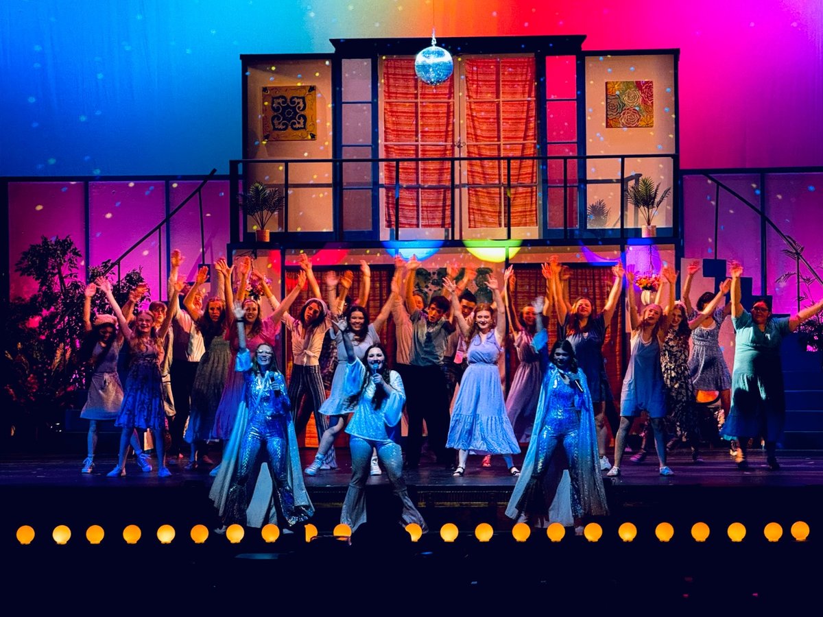 Colorful Mamma Mia student theatre production on stage