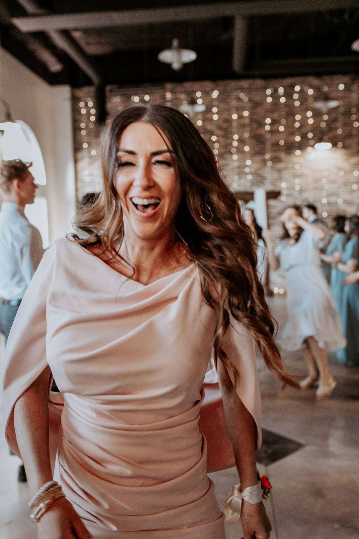 Bride laughing during wedding reception in the Treasure Valley Idaho, professional DJ entertainment by SwissMixx Audio
